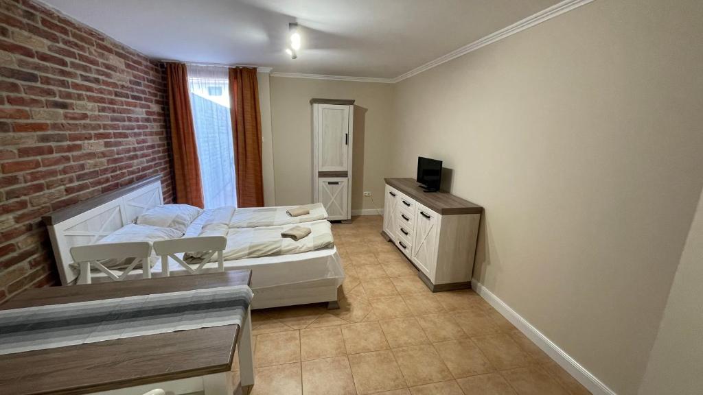 Łóżko lub łóżka w pokoju w obiekcie Dalma Apartment