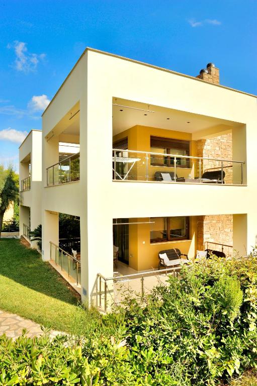 an image of a house from the backyard at Sani Polyastron Hotel & Spa in Sani Beach