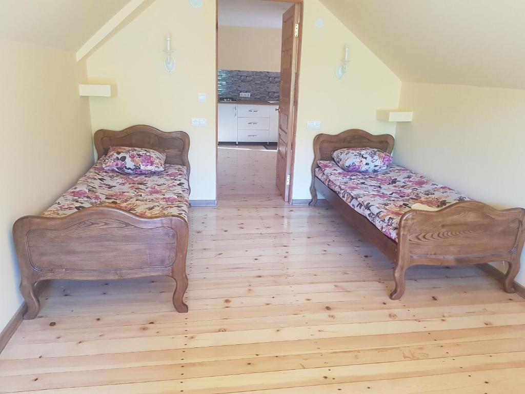 Llit o llits en una habitació de Guest House Sando