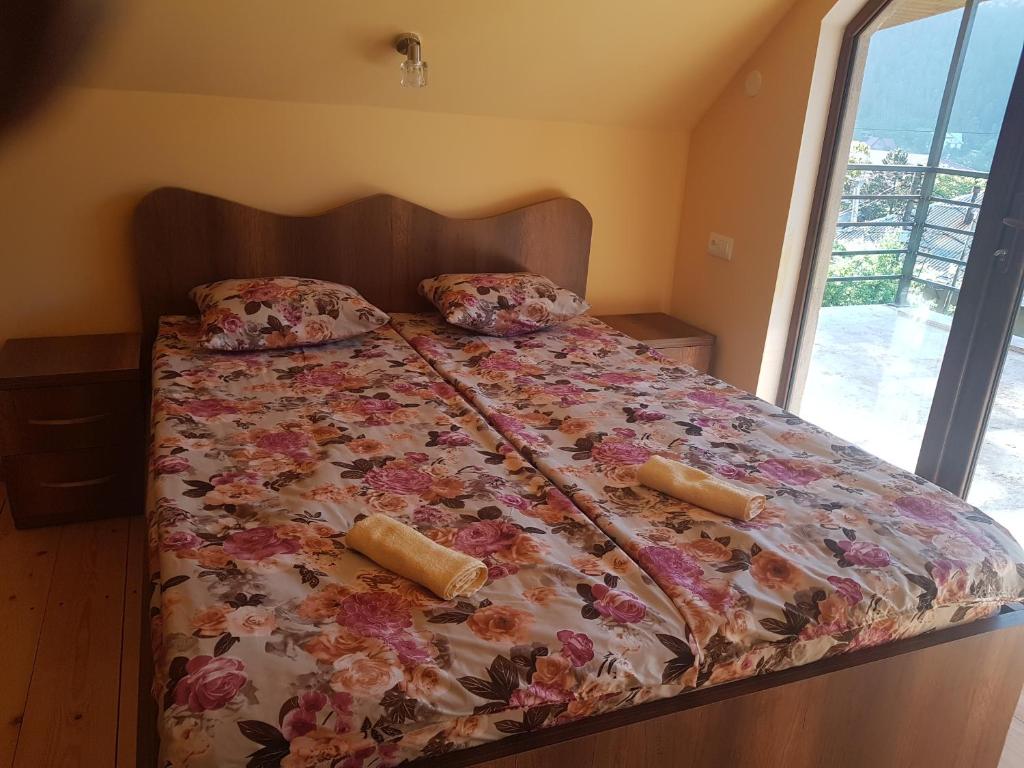 Llit o llits en una habitació de Guest House Sando