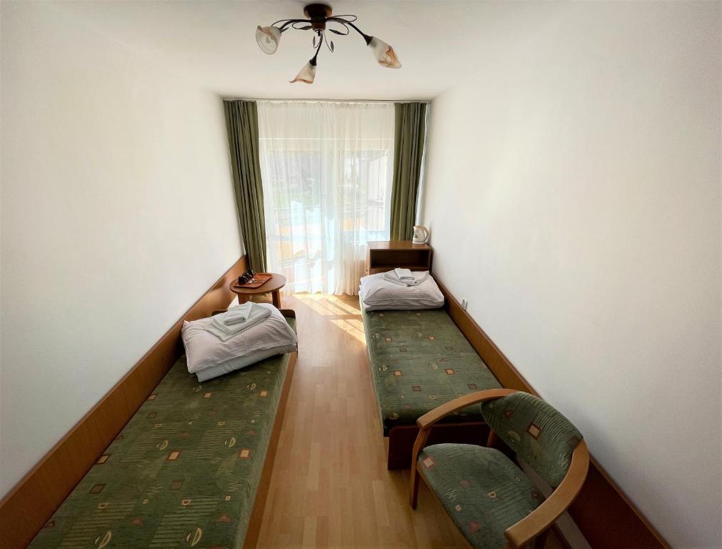 Postel nebo postele na pokoji v ubytování Ośrodek Jantar Rewita