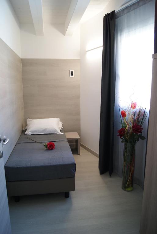 A bed or beds in a room at Hotel Residence Sanremo