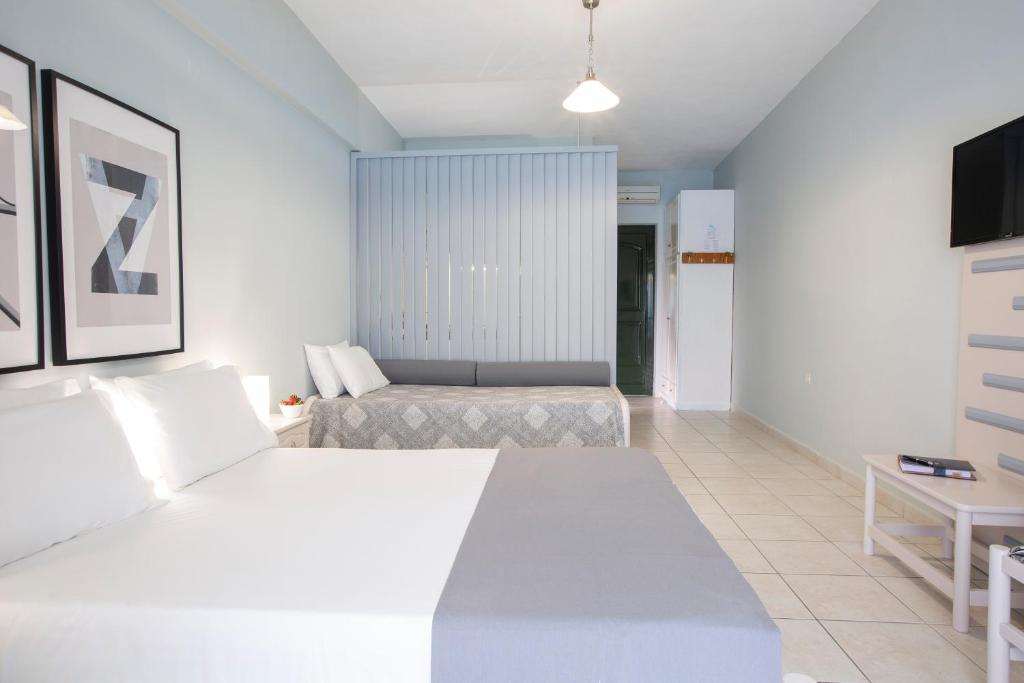 Posteľ alebo postele v izbe v ubytovaní Captain Nick Aparthotel