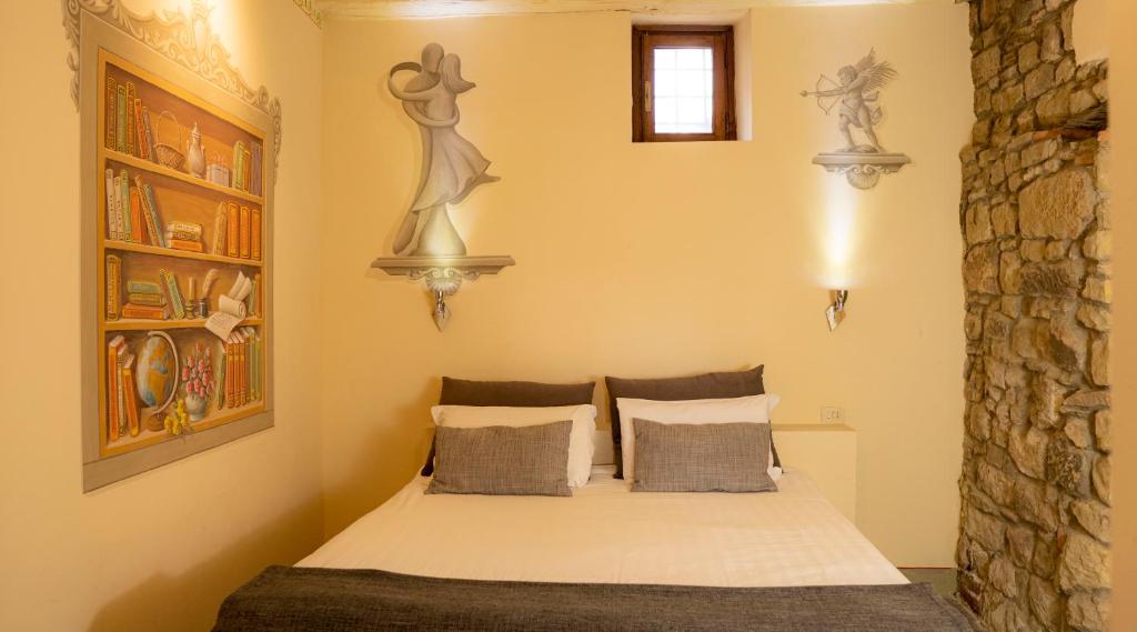 Postel nebo postele na pokoji v ubytování Fattorie di Celli