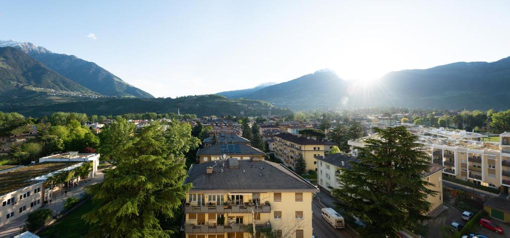 a view of a city with mountains in the background at Avista Apartments Sky in Merano