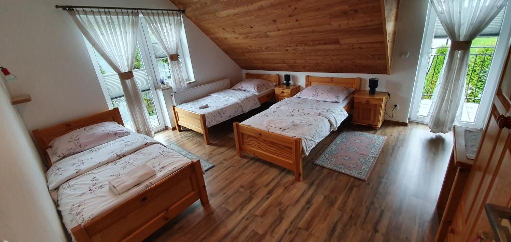 Posteľ alebo postele v izbe v ubytovaní Agroturystyka na Słonecznej Orawie u Dzikich
