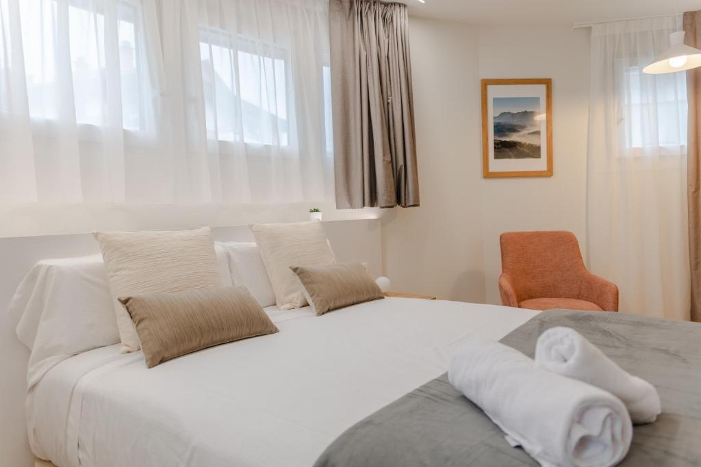 Postel nebo postele na pokoji v ubytování HOTEL ORDIZIA
