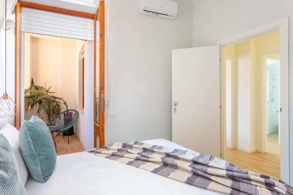 Posteľ alebo postele v izbe v ubytovaní Domus Laetitiae Rooms & Apartments