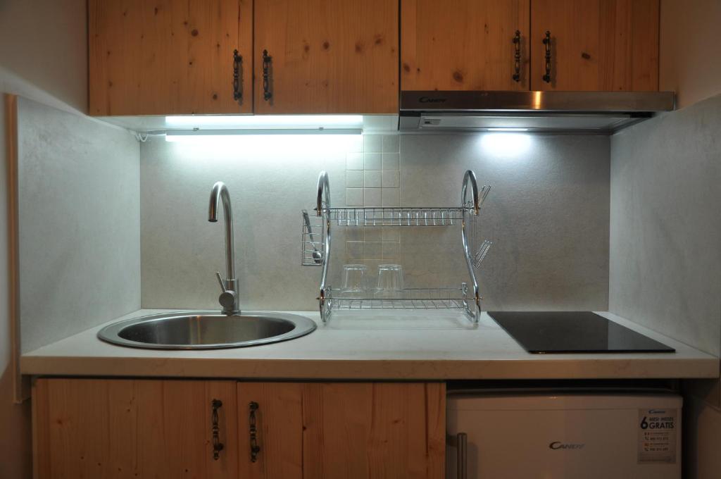 a kitchen with a sink and a counter top at STARA KOVAČNICA in Golubac