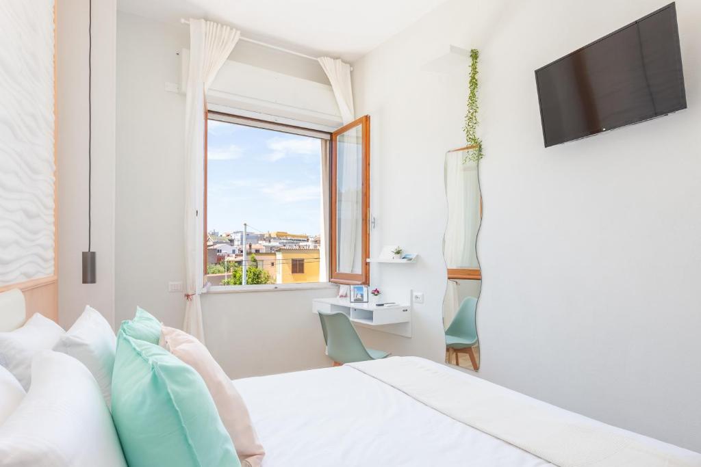 Posteľ alebo postele v izbe v ubytovaní Domus Laetitiae Rooms & Apartments