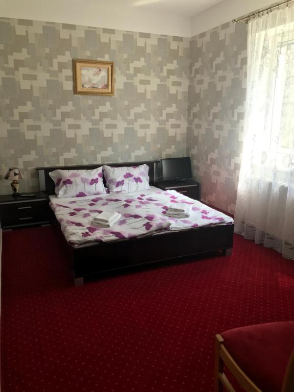 Postel nebo postele na pokoji v ubytování Zajazd Dajana