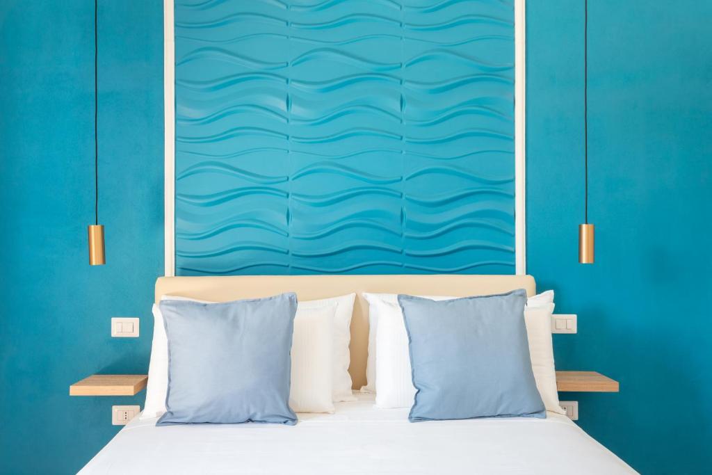 Posteľ alebo postele v izbe v ubytovaní Domus Laetitiae Rooms & Apartments