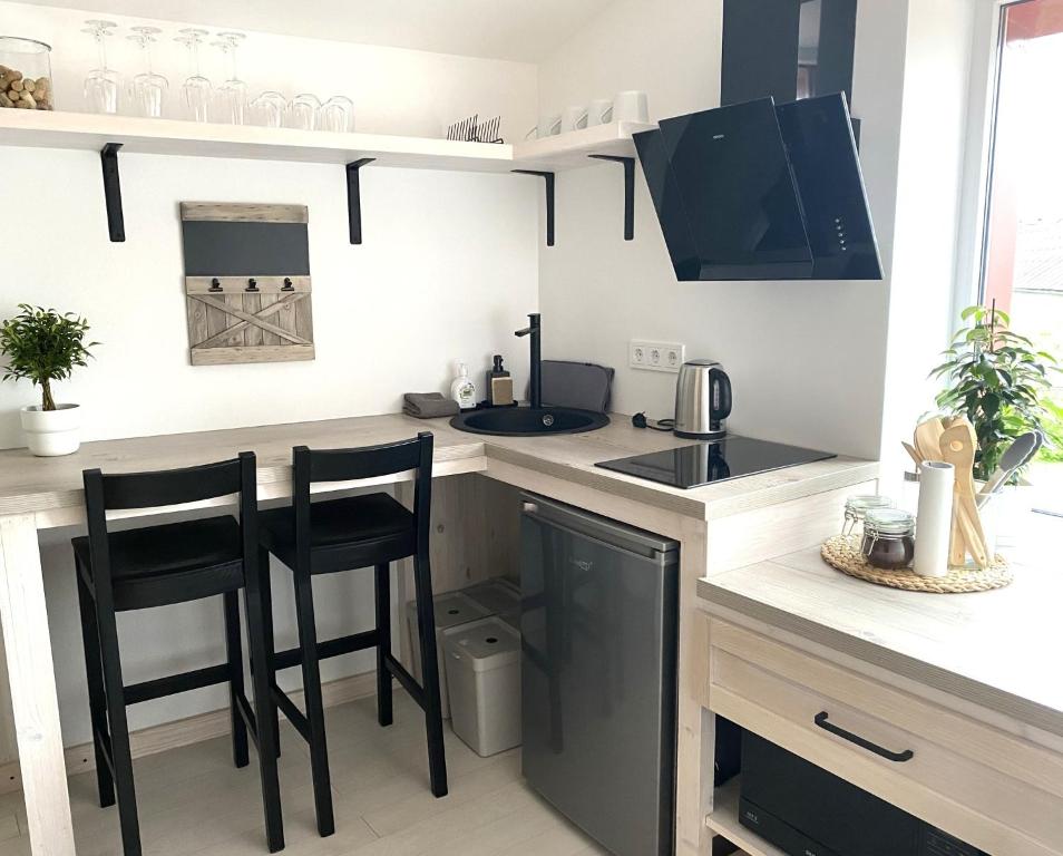 Kuchyň nebo kuchyňský kout v ubytování West Key Apartment