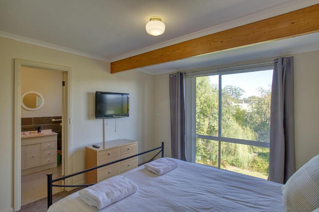 Postel nebo postele na pokoji v ubytování Cockatoo Cabin