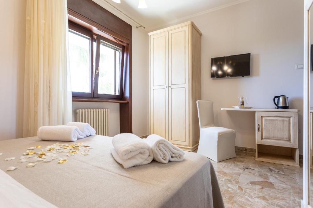 Postel nebo postele na pokoji v ubytování B&B Domus Japigia