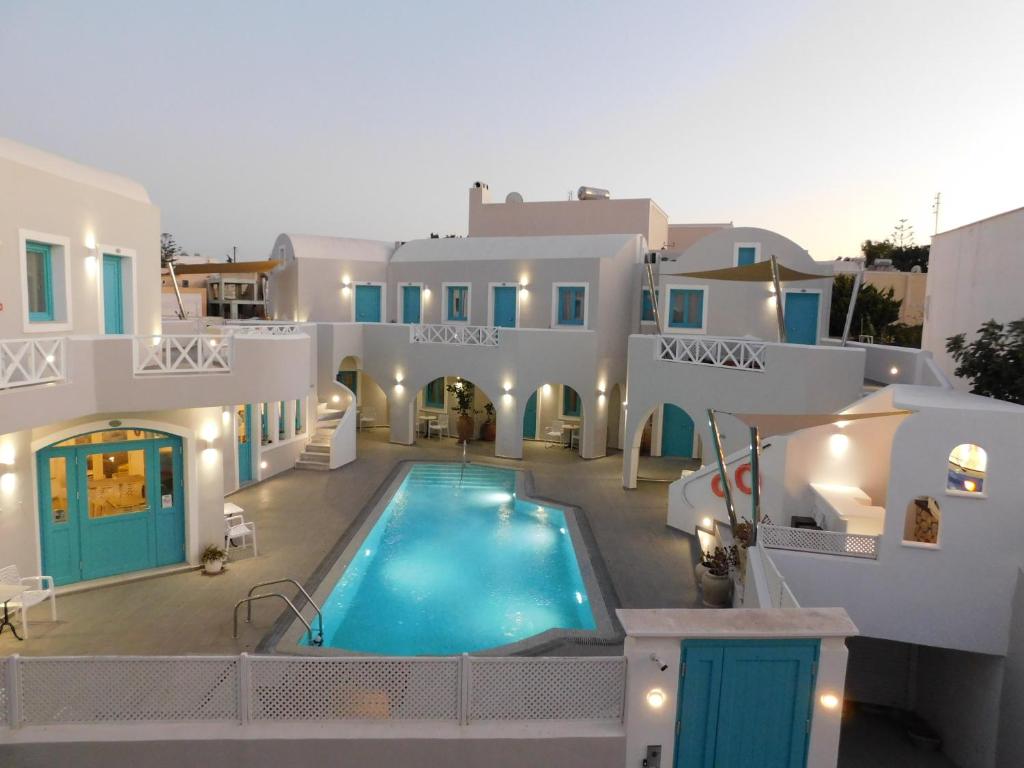 arial view of a villa with a swimming pool at Nikolas Hotel in Karterados