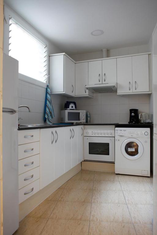 Kuchyňa alebo kuchynka v ubytovaní Colom Apartments