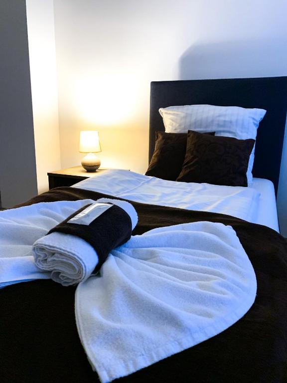 Łóżko lub łóżka w pokoju w obiekcie Aranykorona Apartmanház