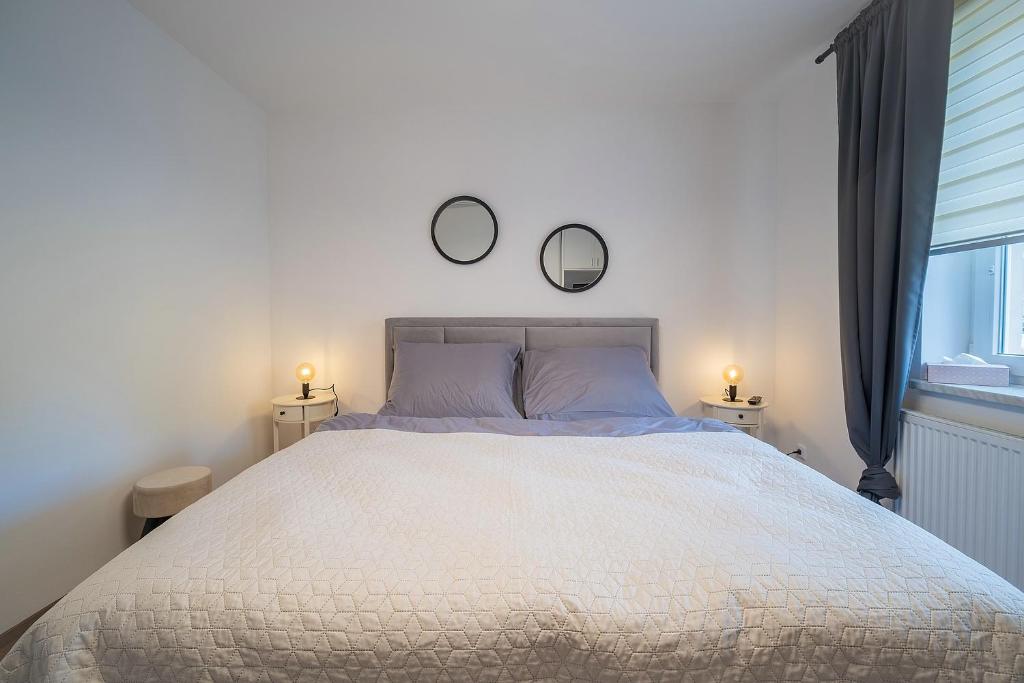 Postel nebo postele na pokoji v ubytování Apartmán U řeky