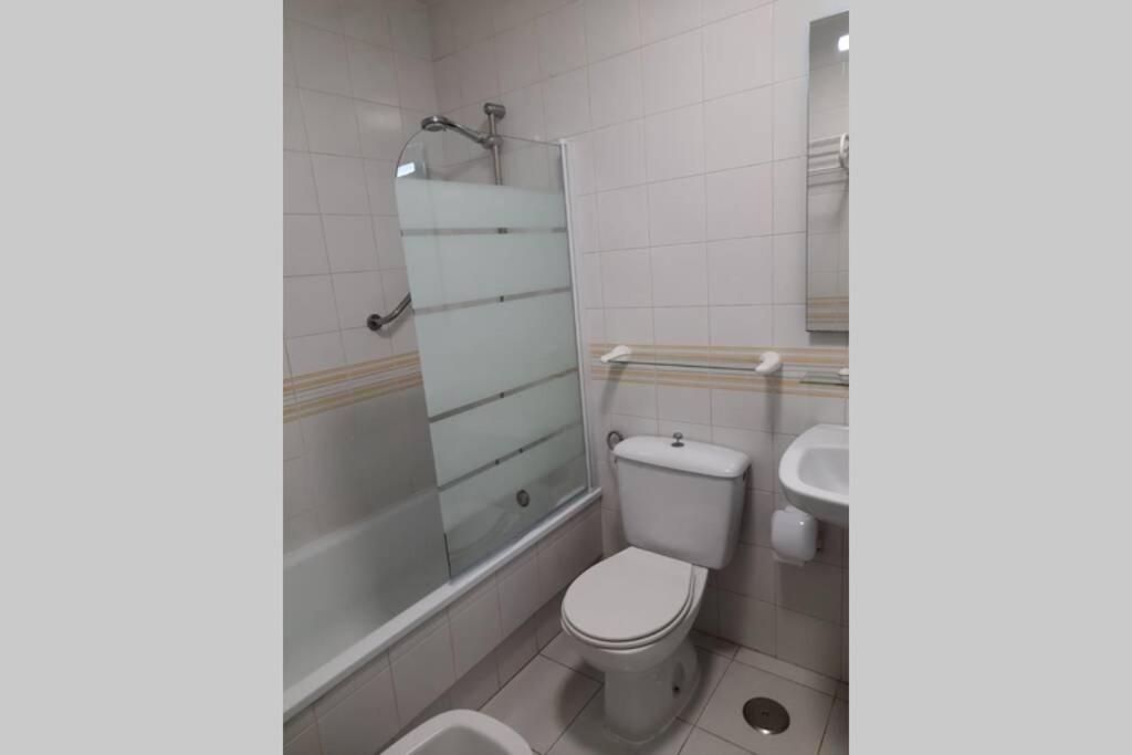 A bathroom at Cozy studio apartment near the beach