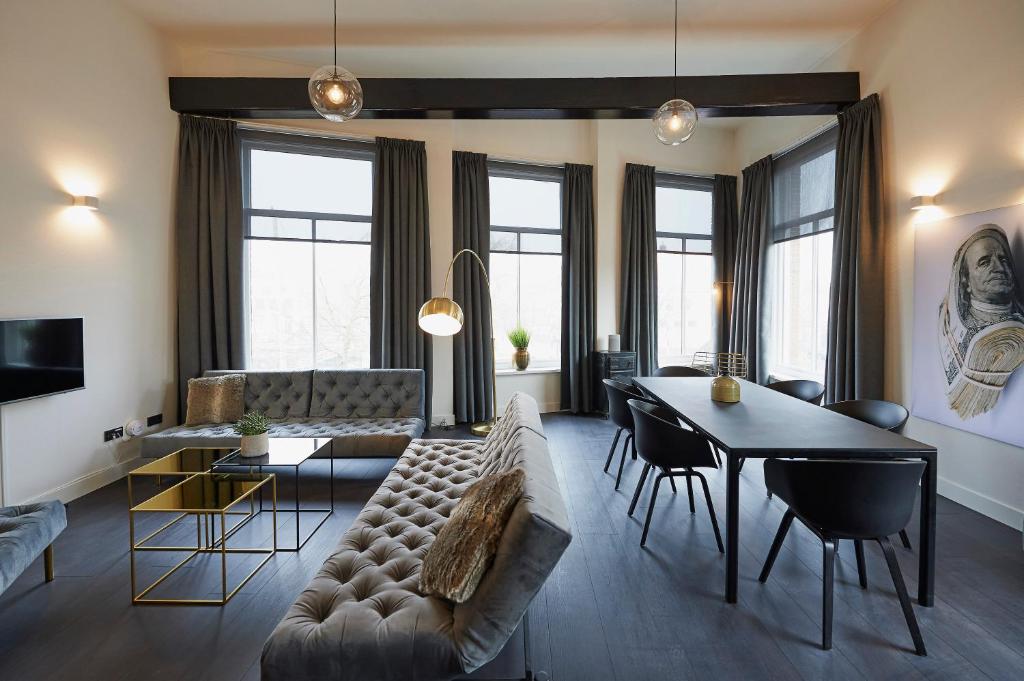 TV a/nebo společenská místnost v ubytování "DE BANK" - Hotel Apartments