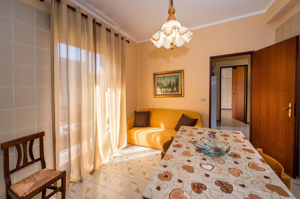 a bedroom with a table and a bed in a room at Case Maria in Castellammare del Golfo