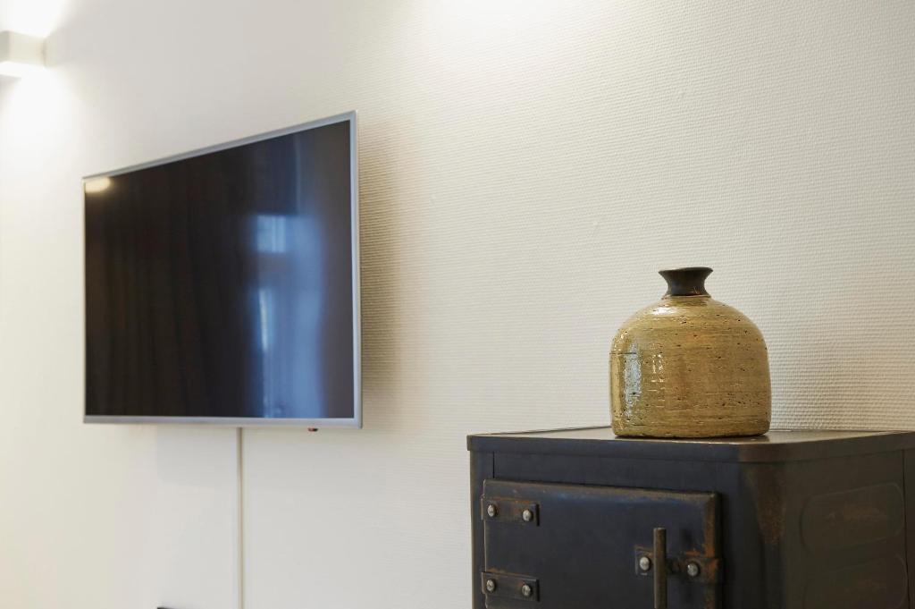 TV a/nebo společenská místnost v ubytování "DE BANK" - Hotel Apartments