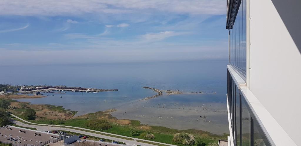 a view of the ocean from a building at Snäck Apartment floor 11 sea view in Visby