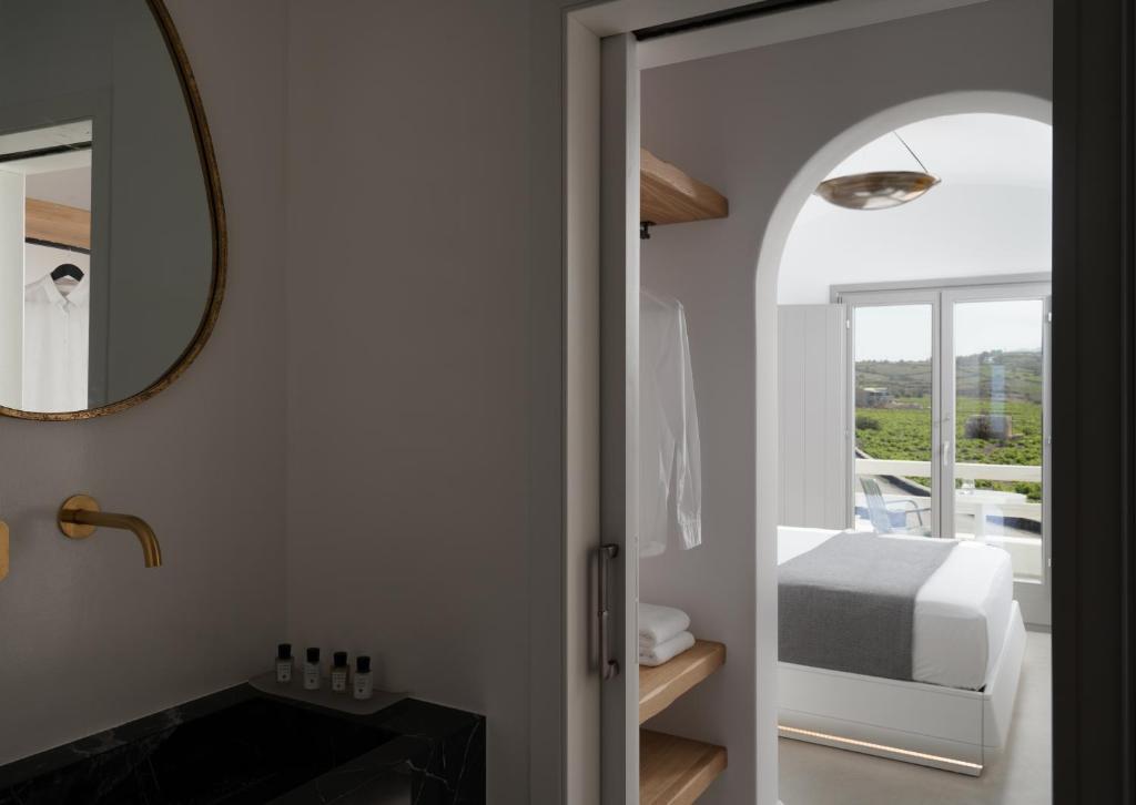 Postel nebo postele na pokoji v ubytování La Ponta Villas & Suites
