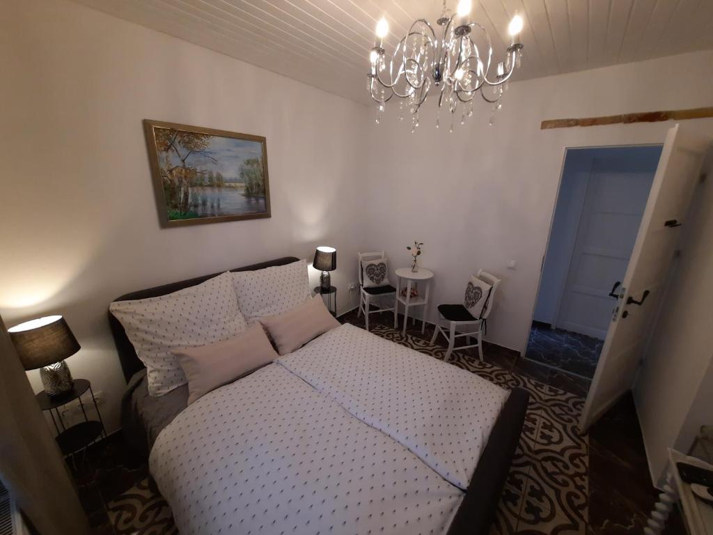 Postel nebo postele na pokoji v ubytování Piac Vendégház