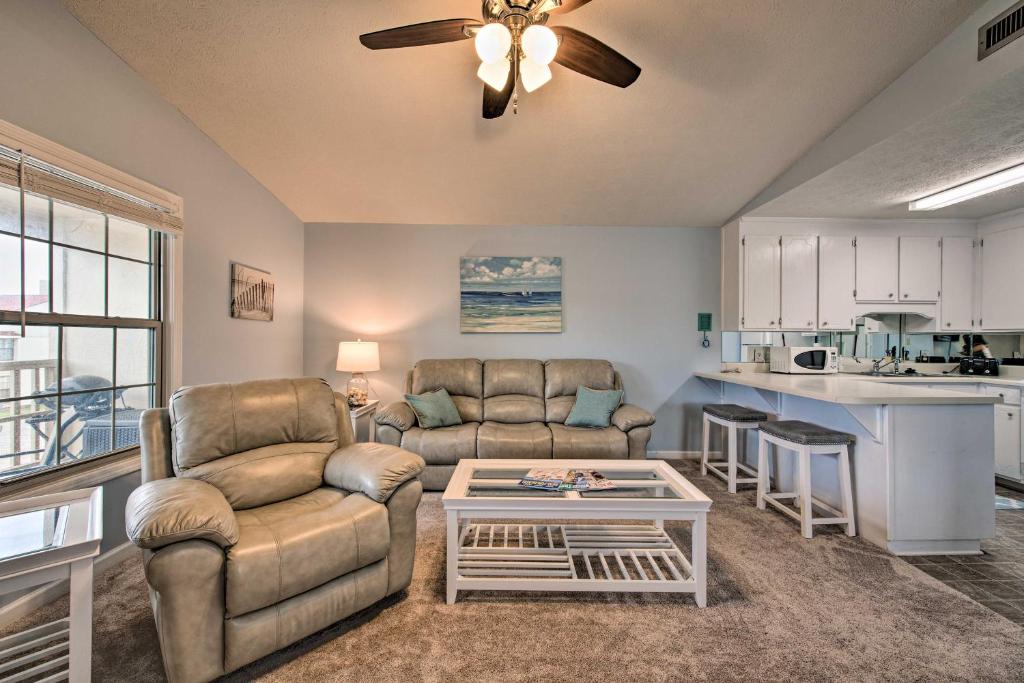 a living room with two couches and a table at PCB Resort Condo with Private Balcony and 3 Pools! in Panama City Beach