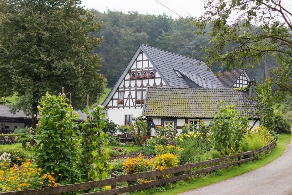 a house with a garden in front of it at Ferienhof Richard in Lennestadt