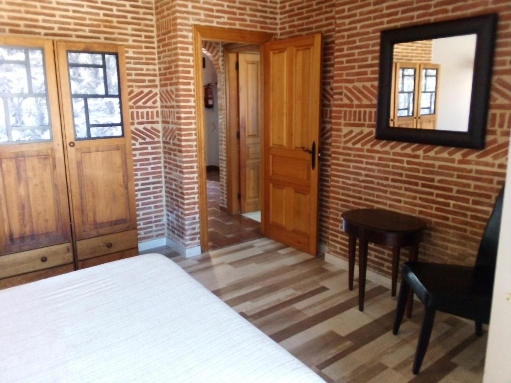 Postel nebo postele na pokoji v ubytování Las Cabañas de Pimiango