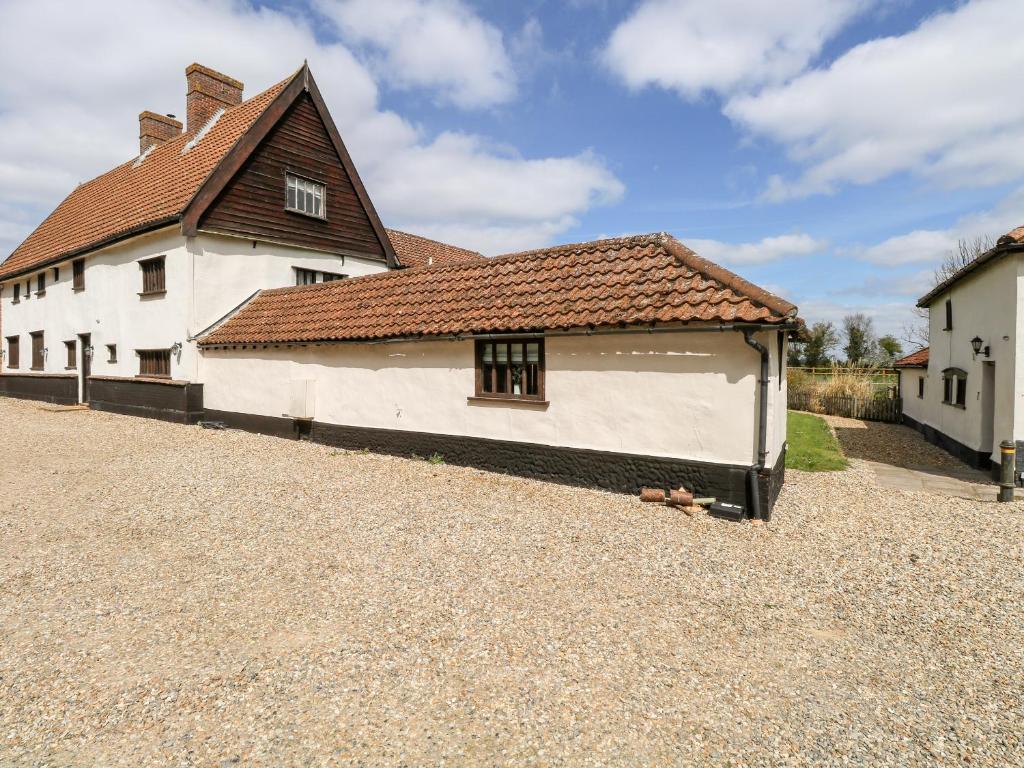 a large white building with a brown roof at Waterloo Retreat in Norwich