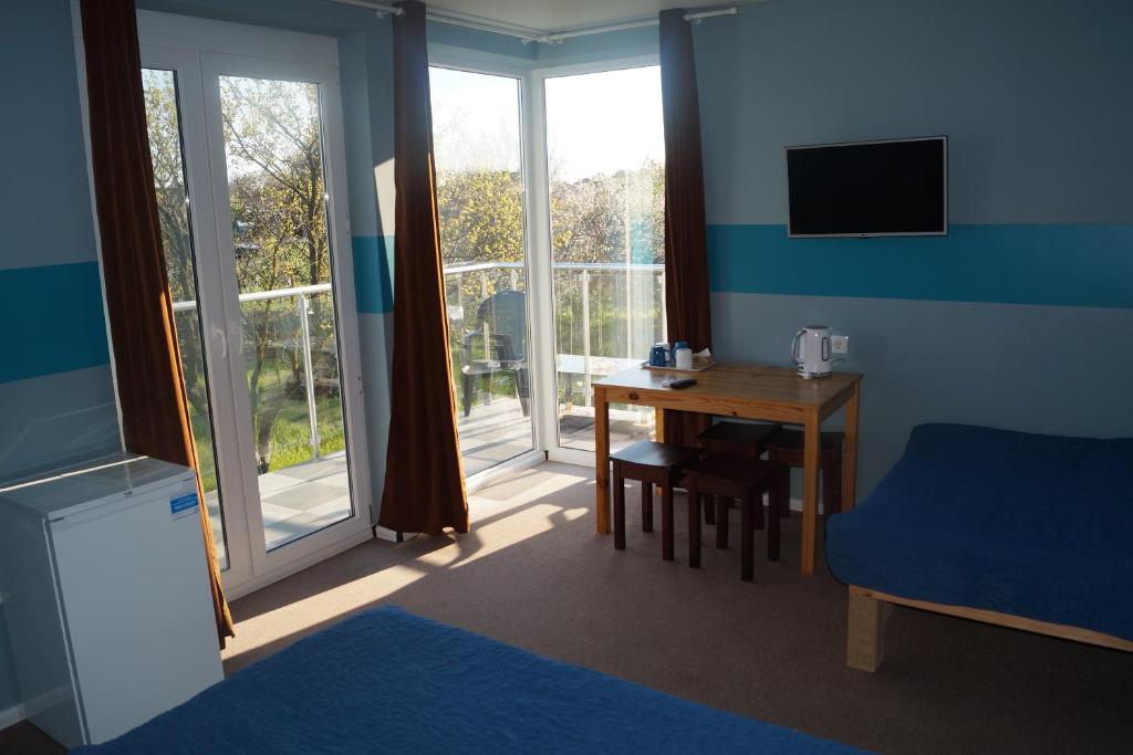 Postel nebo postele na pokoji v ubytování Hotel Jonik Land