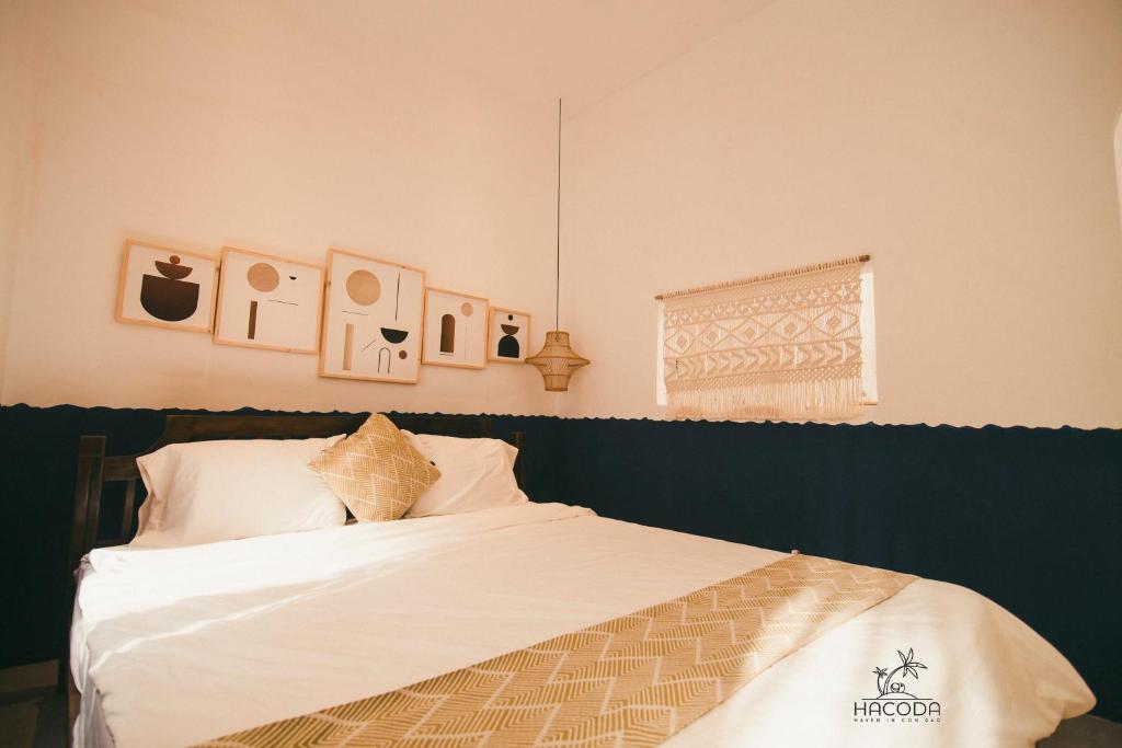 Postel nebo postele na pokoji v ubytování Hacoda Homestay