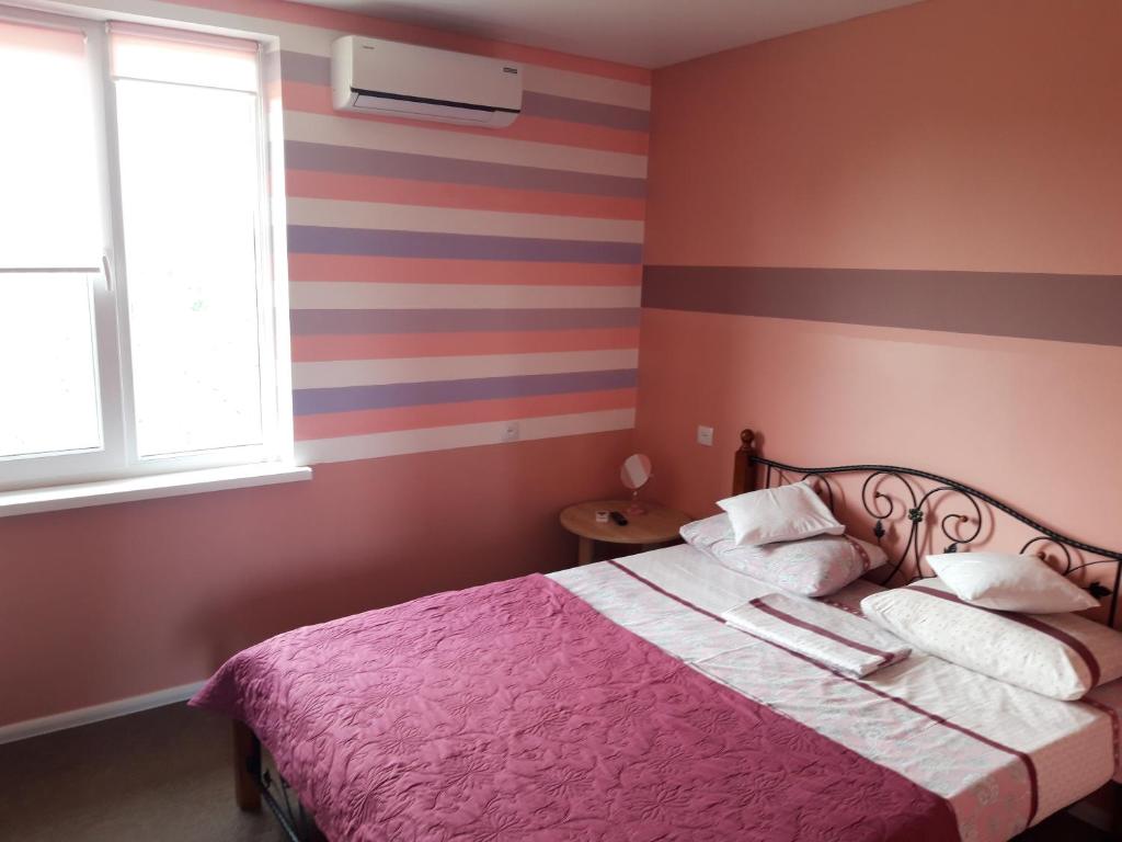Postel nebo postele na pokoji v ubytování Hotel Jonik Land