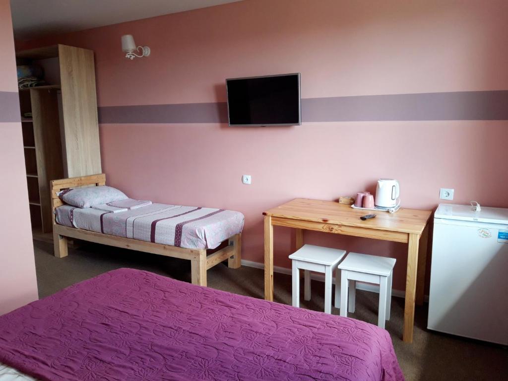 Postel nebo postele na pokoji v ubytování Hotel Jonik Land