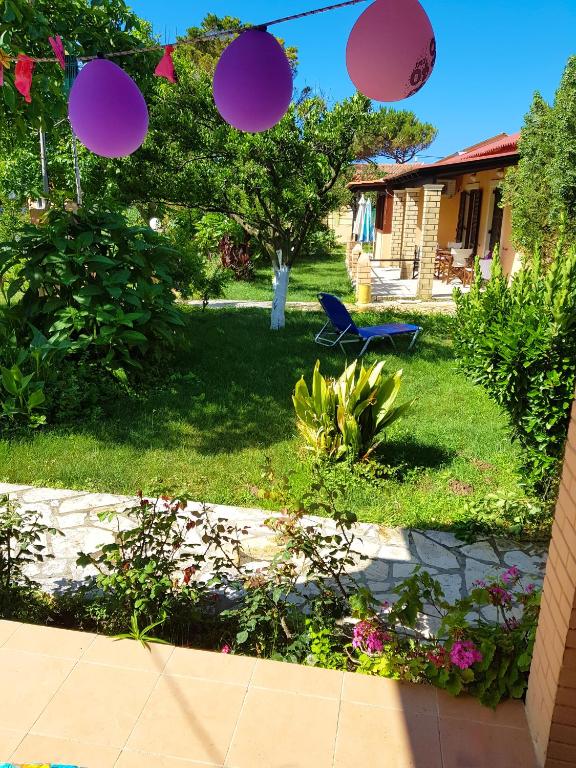A garden outside Beach house Yannis in Agios Gordios beach on Corfu