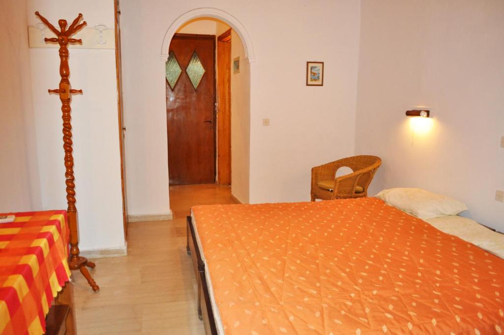 A bed or beds in a room at Beach house Yannis in Agios Gordios beach on Corfu