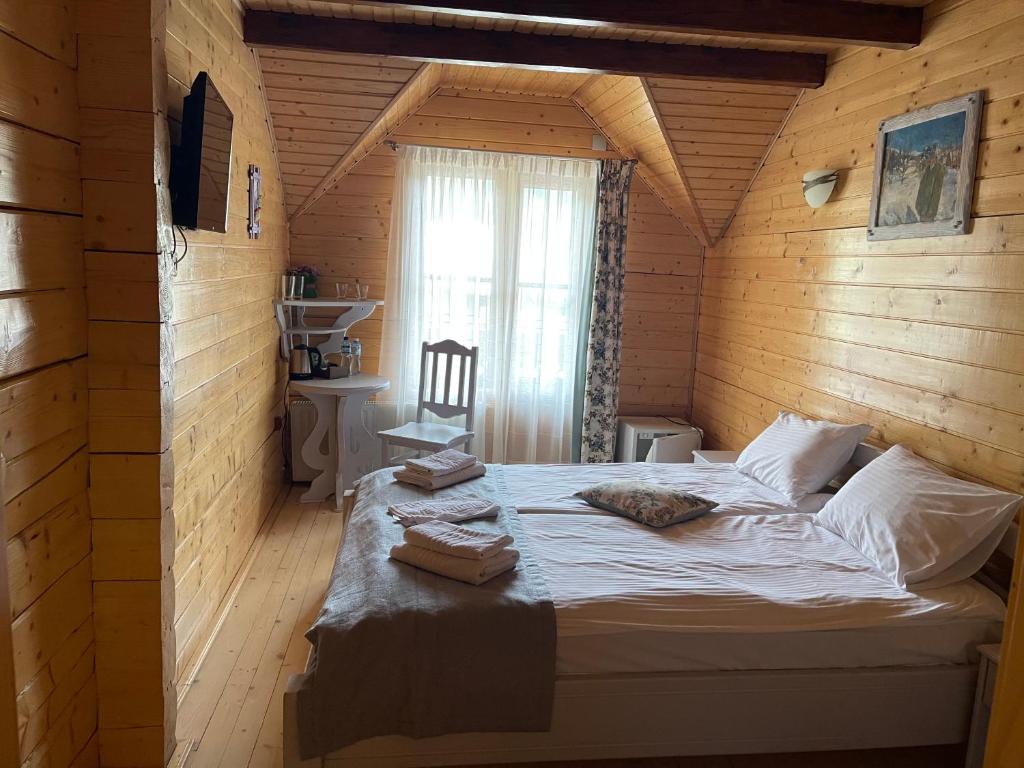 Postel nebo postele na pokoji v ubytování Villa "Затишна"