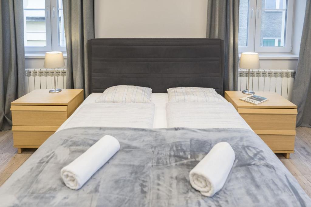 Posteľ alebo postele v izbe v ubytovaní Apartament pod Twierdzą