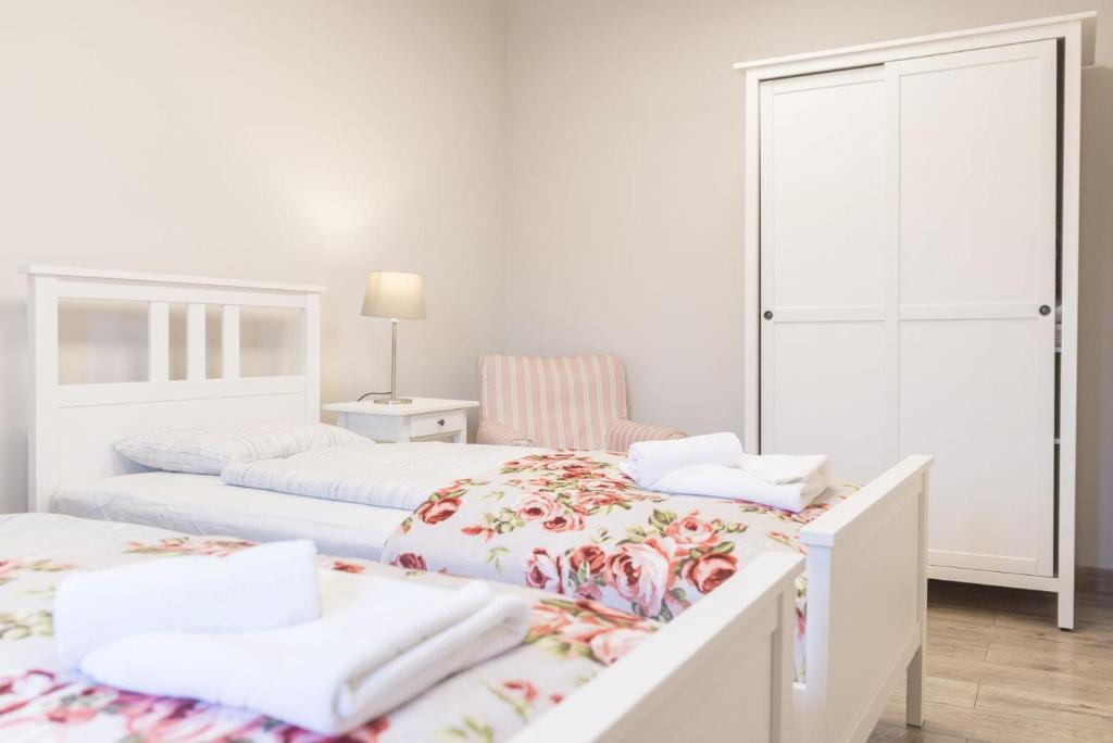 Posteľ alebo postele v izbe v ubytovaní Apartament pod Twierdzą