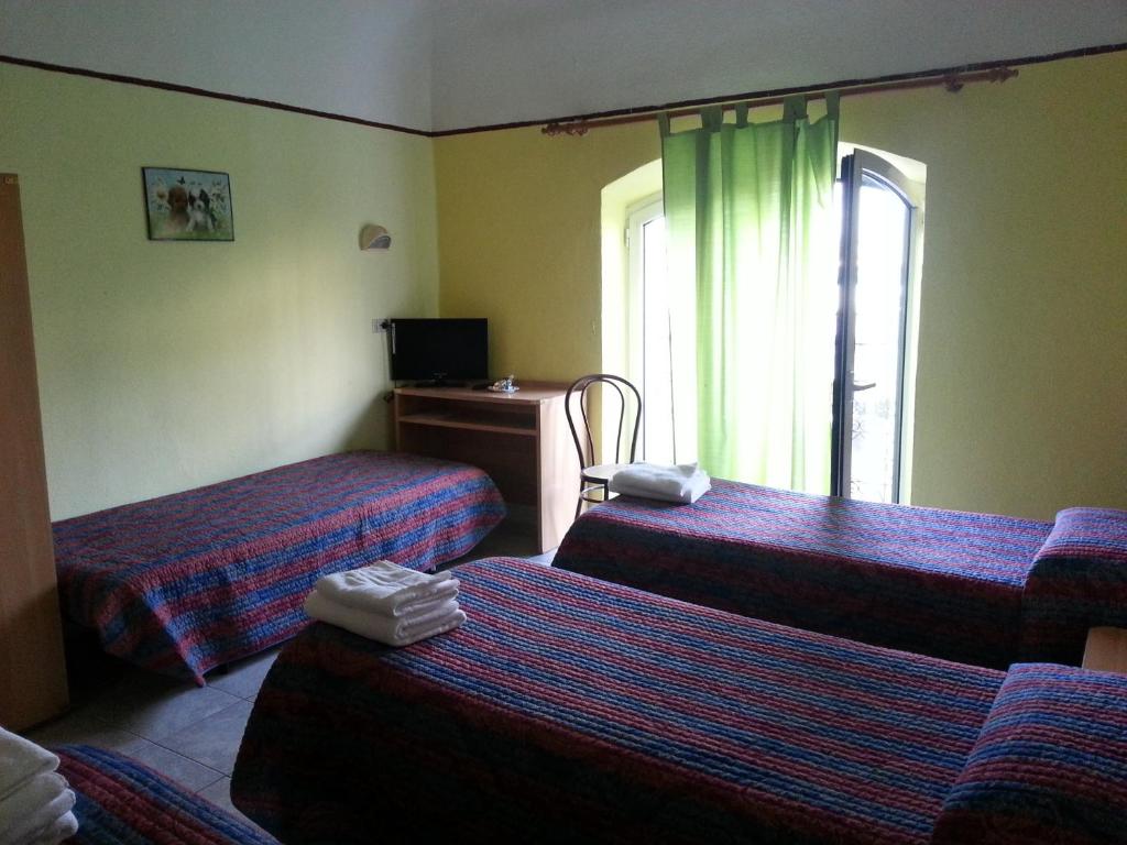 TV a/nebo společenská místnost v ubytování Hotel Stazione