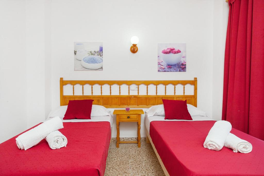A bed or beds in a room at Apartamentos Puet