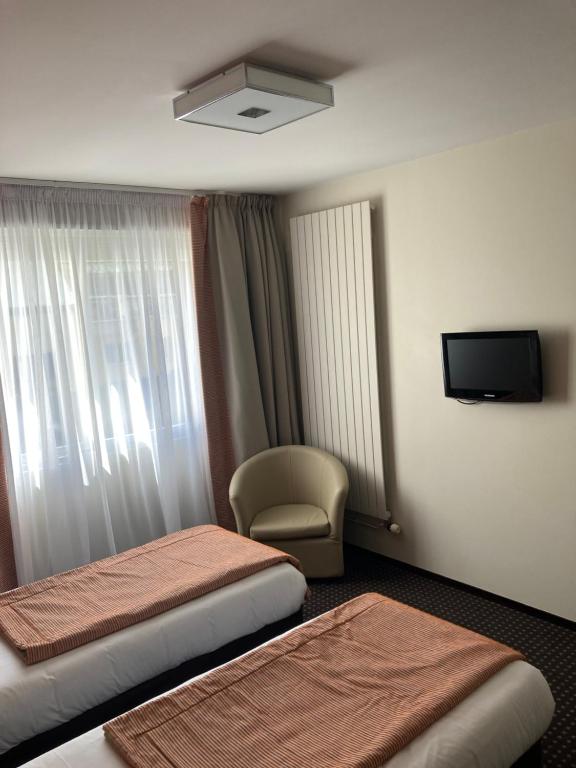 Postel nebo postele na pokoji v ubytování Hotel Georges