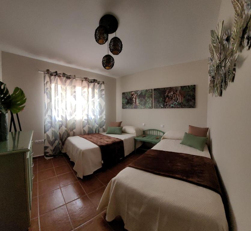 Ένα ή περισσότερα κρεβάτια σε δωμάτιο στο Residencial Oasis Park