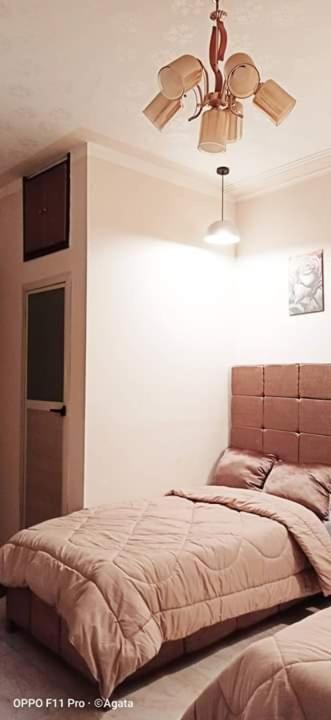 Postel nebo postele na pokoji v ubytování grand agata hostel