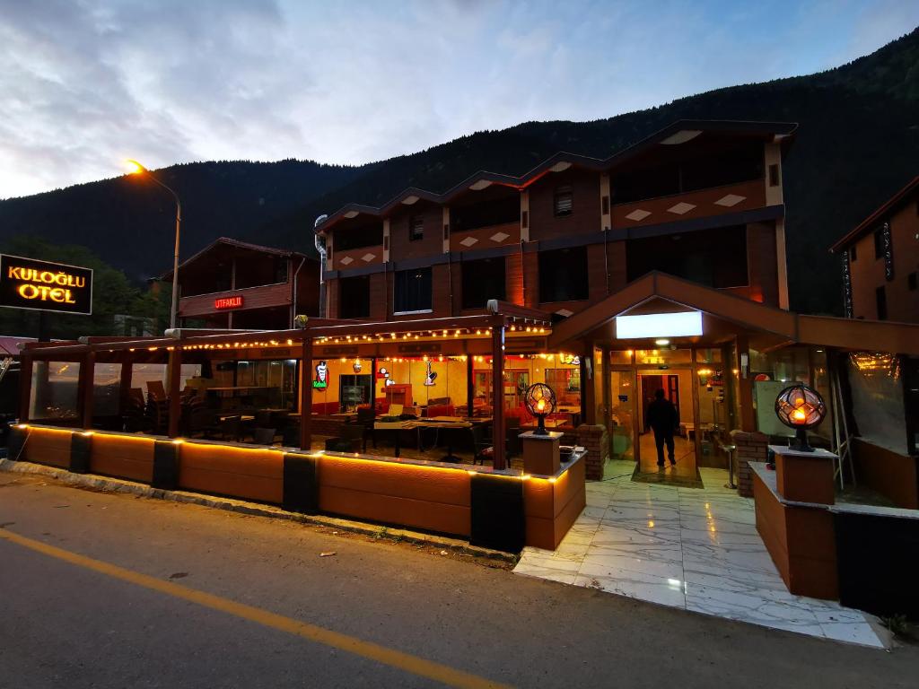 a building with a restaurant on the side of the street at Kuloğlu Otel ve Restoran in Uzungol