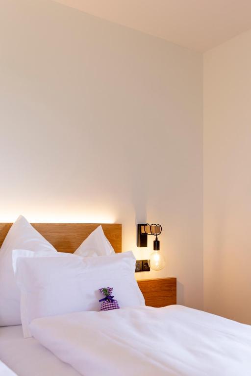 Postel nebo postele na pokoji v ubytování Winzer Appartements Kogler